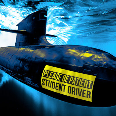 Submarine underwater with a humorous "Please be patient, student driver" sign on the side.