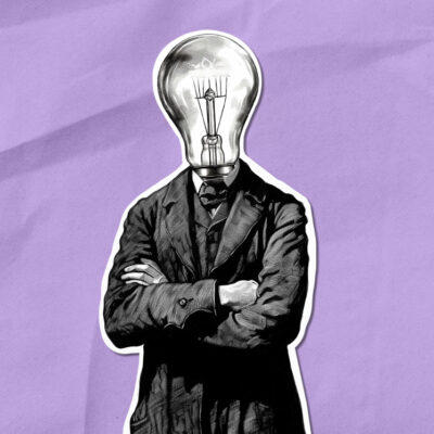 A person in a suit with a light bulb for a head, standing with arms crossed against a crumpled purple background.