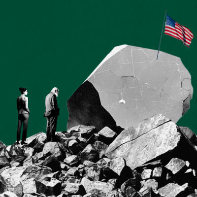 People in business attire stand on rocky terrain, facing a large cracked boulder with an American flag planted on top, against a dark green background.