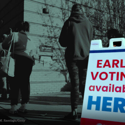 People standing in line outside a building for early voting; a sign reads: "EARLY VOTING available HERE.