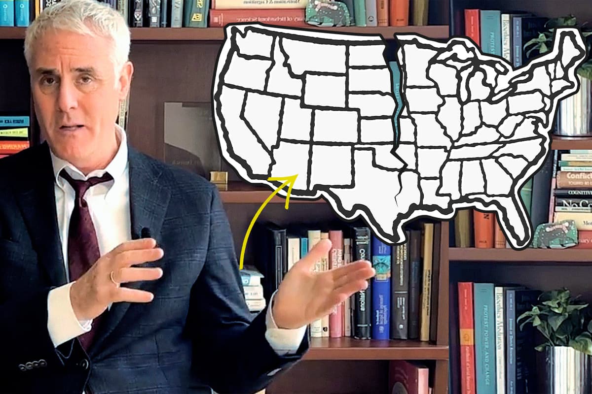 A man gestures to a U.S. map outline, indicating a specific area.